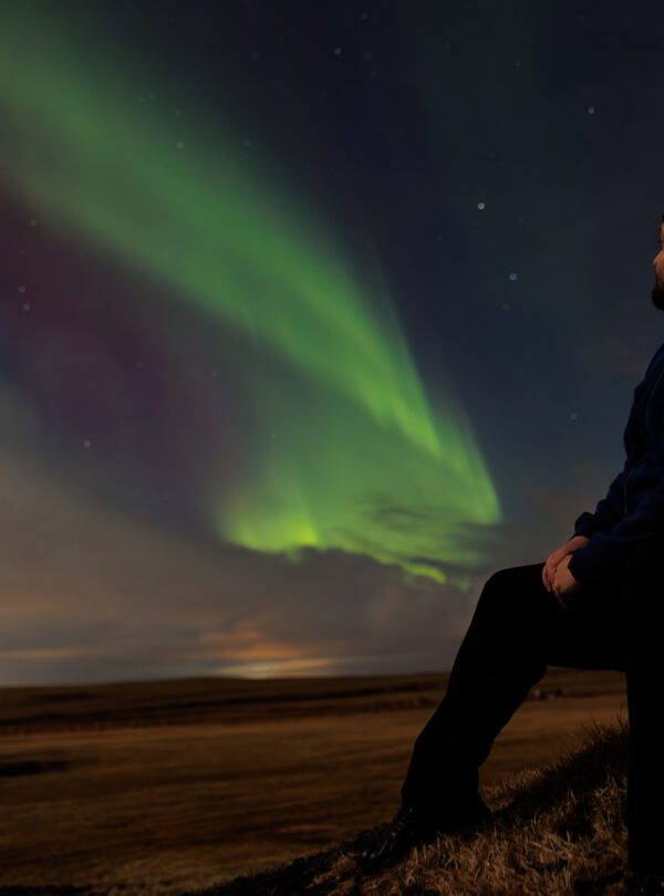 Traveller appreciating northern lights