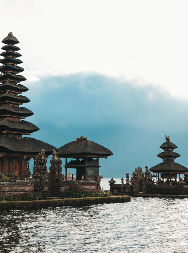 Pura Ulun Danu Bratan, Bali. Hindu temple surrounded by flowers on Bratan lake